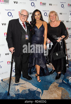 London, UK. 16th January, 2019. Rosie Williams with Desmond Barnett and her grandmother attends the Legends Of Rugby Dinner 2019 in aid of Nordoff Robbins at The Grosvenor House Hotel on January 16, 2019 in London, England. Credit: Gary Mitchell, GMP Media/Alamy Live News Stock Photo