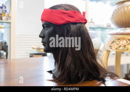 Berlin, Germany. 17th Jan, 2019. A head model with a wig by Winnetou actor Pierre Brice stands on a table in an auction house. On 26 January, the Berlin auction house will auction off numerous pieces from the estate of the legendary Karl May actor. Credit: Paul Zinken/dpa/Alamy Live News Stock Photo