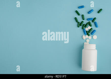 Plastic bottle and spilled pills Stock Photo