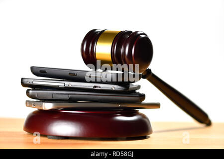 Smartphones and gavel, 5G frequencies auction Stock Photo