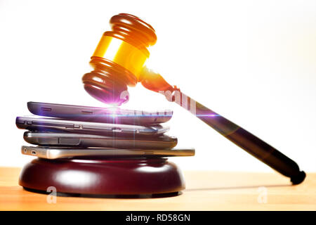 Smartphones and gavel, 5G frequencies auction Stock Photo