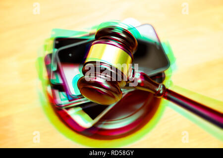 Smartphones and gavel, 5G frequencies auction Stock Photo