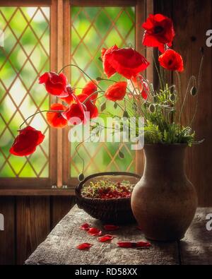 Still life with bouquet of red poppies Stock Photo - Alamy