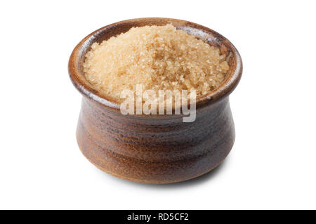Studio shot of a pot of brown sugar isolated on white background - John Gollop Stock Photo