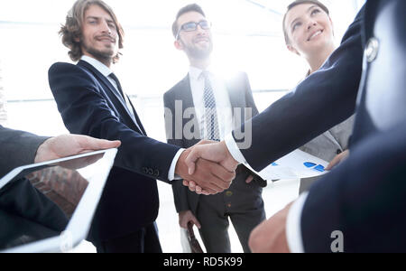employees look at the handshake business partners Stock Photo