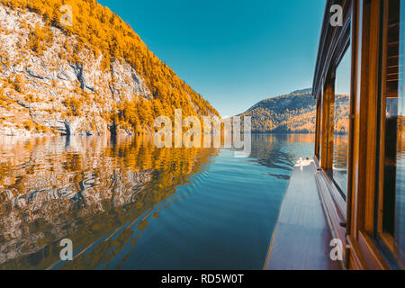 Traditional passenger boat gliding on Lake Konigssee with Watzmann mountain in the background on a beautiful sunny day in fall, Berchtesgadener Land,  Stock Photo