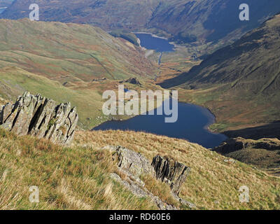 spectacular landscape with rocks looking over Small Water and Haweswater on the way up to High Street in the Lakeland Fells, Cumbria, England, UK Stock Photo