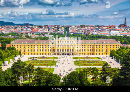 Classic view of famous Schonbrunn Palace with Great Parterre garden on a beautiful sunny day with blue sky and clouds in summer, Vienna, Austria Stock Photo