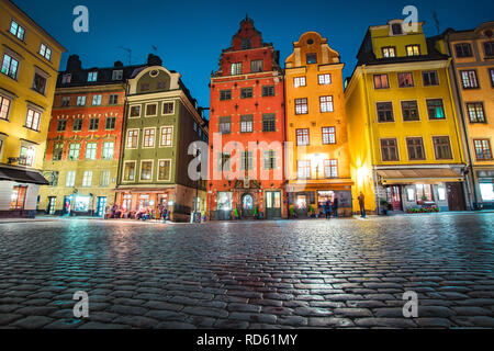 Classic view of colorful houses at famous Stortorget town square in Stockholm's historic Gamla Stan (Old Town) at night, central Stockholm, Sweden Stock Photo