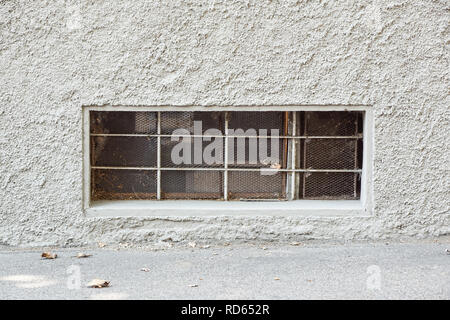 Old iron door glass brick wall close up Stock Photo