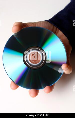 Hand holding a CD or DVD Stock Photo