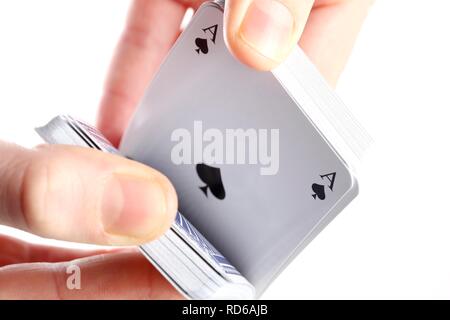 Hand holding a deck of playing cards Stock Photo