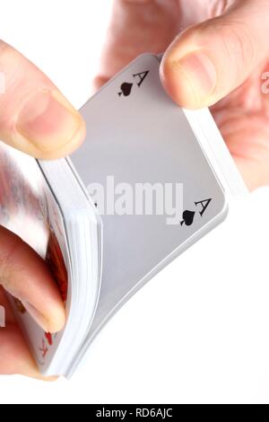 Hand holding a deck of playing cards Stock Photo