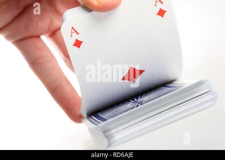 Hand holding a deck of playing cards Stock Photo