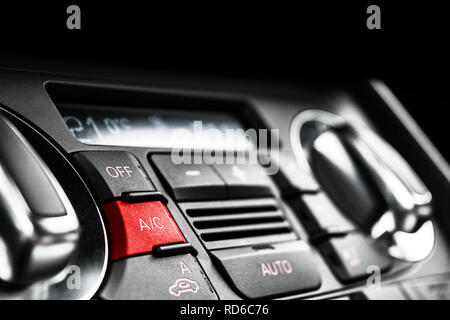 Air conditioning button inside a car. Climate control AC unit in the new car. Modern car interior details. Car detailing. Stock Photo