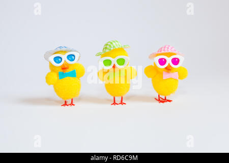 Easter decoration with three funny yellow chicks isolated on white background. Easter holiday concept. Stock Photo