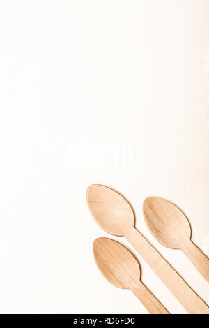 Wooden spoon Eco-friendly disposable utensils made of bamboo wood and paper Stock Photo
