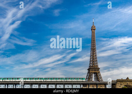 Paris Metro No 6 line train crosses the River Seine via Pont de Bir-Hakeim and passes by The Eiffel Tower Stock Photo