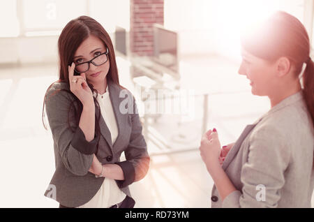 two employees on a blurred office background Stock Photo