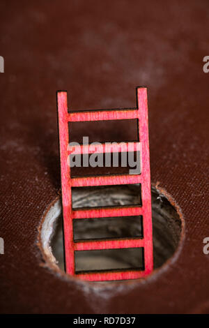 Stacked books and small ladder appear from inside the book. Abstract illustration concept for knowledge and education. Stock Photo