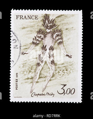 Postage stamp from France depicting the Chaplain Midy painting Fire Dancer from the Magic Flute Stock Photo