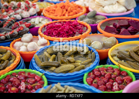 Turkish pickles in local market. Traditional Turkish pickles of various fruits and vegetables. Stock Photo