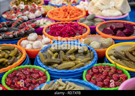 Turkish pickles in local market. Traditional Turkish pickles of various fruits and vegetables. Stock Photo