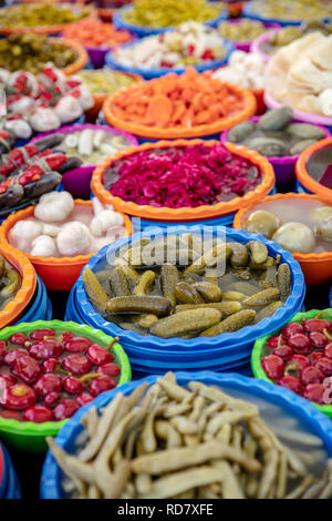 Turkish pickles in local market. Traditional Turkish pickles of various fruits and vegetables. Stock Photo