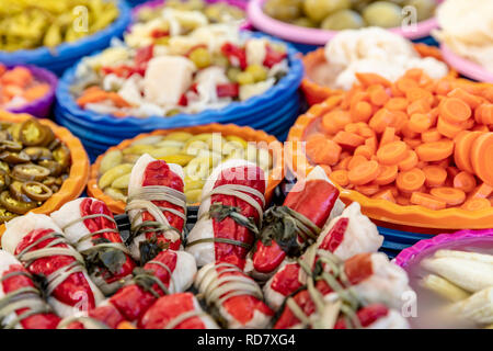 Turkish pickles in local market. Traditional Turkish pickles of various fruits and vegetables. Stock Photo