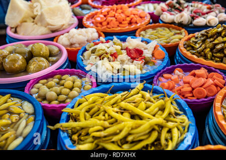 Turkish pickles in local market. Traditional Turkish pickles of various fruits and vegetables. Stock Photo