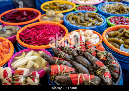 Turkish pickles in local market. Traditional Turkish pickles of various fruits and vegetables. Stock Photo