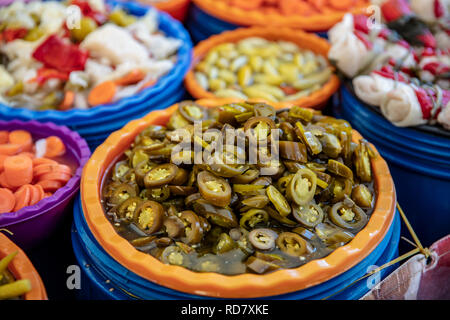 Turkish pickles in local market. Traditional Turkish pickles of various fruits and vegetables. Stock Photo