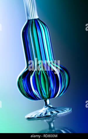 Blue and green glass ornament, studio shot Stock Photo
