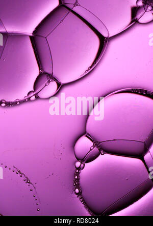 Close up of bubbles on purple background, studio shot Stock Photo