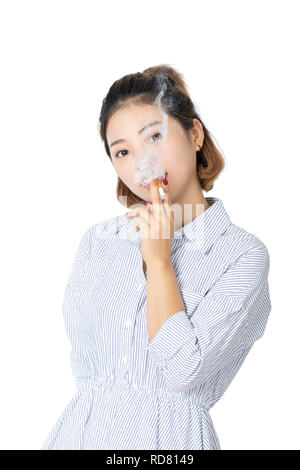 Beautiful Chinese American woman wearing a dress and smoking a cigarette isolated on a white background Stock Photo