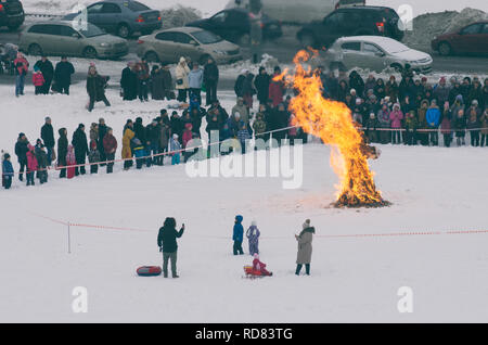 Saint Petersburg , Russia - February 17, 2018: Russian holiday Maslenitsa. The burning of the straw figure symbolizing winter. Stock Photo