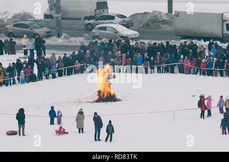 Saint Petersburg , Russia - February 17, 2018: Russian holiday Maslenitsa. The burning of the straw figure symbolizing winter. Stock Photo