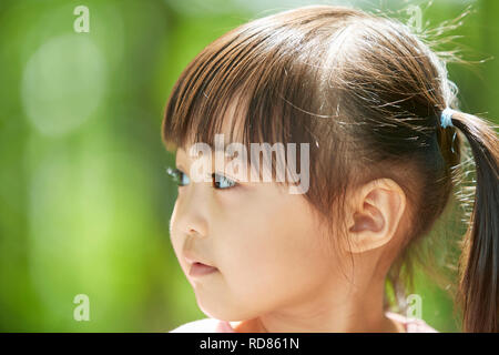 Japanese kid in a city park Stock Photo