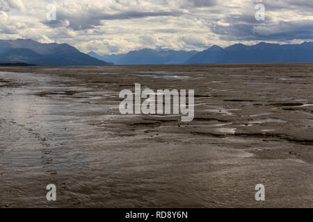 Low tide in Cook Inlet exposes miles of glacial mudflats at the Kincaid Park beach in Anchorage, Alaska Stock Photo