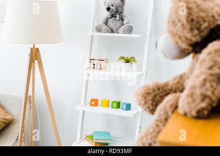 modern interior of nursery room with rack and toys Stock Photo