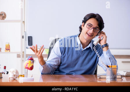 Young lecturer teacher teaching anatomy Stock Photo