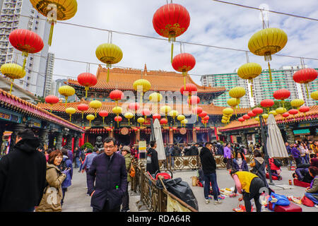 The Main Altar. The Sik Sik Yuen Wong Tai Sin Temple Hong Kong. Worshippers light worship sticks at the alter before making a wish. Stock Photo