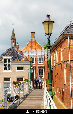 Appingedam, Netherlands - May 19, 2018: street scene in Appingedam with unidentified people. Appingedam has a landmarked medieval town center Stock Photo