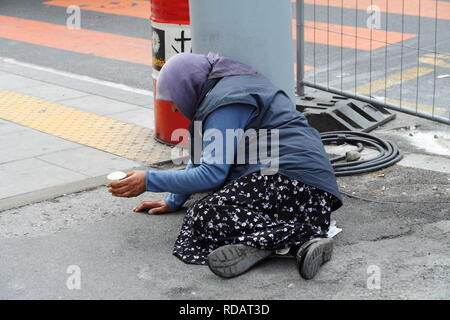 Begging woman Stock Photo