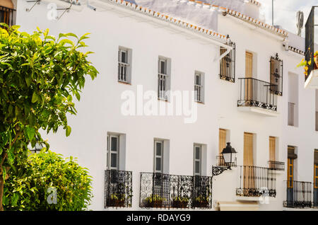 Stylish balcony with a metal railing, solid architectural element, a place of rest and relaxation, vintage decor, balcony Stock Photo