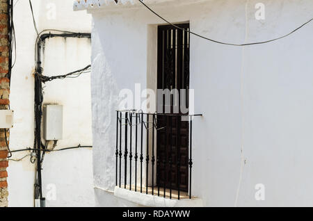 Stylish balcony with a metal railing, solid architectural element, a place of rest and relaxation, vintage decor, balcony Stock Photo