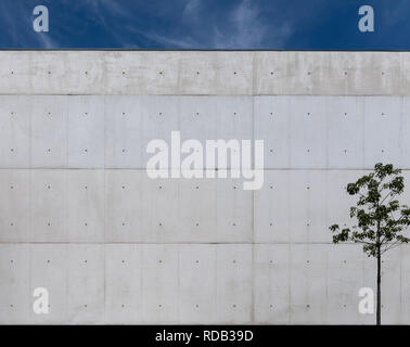 A fine fair faced concrete wall with dark blue sky. Stock Photo