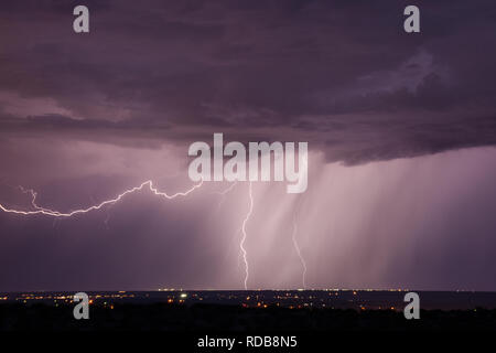 Lightning streaks across the sky in the Desert Southwest USA near El Paso Texas Stock Photo
