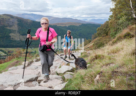 Walkers on the ben nevis path make there way up and down Stock Photo