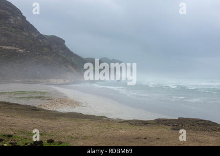 The rugged coastline of Mughsayl, near Salalah, Dhofar Province, Oman, during Khareef monsoon season Stock Photo